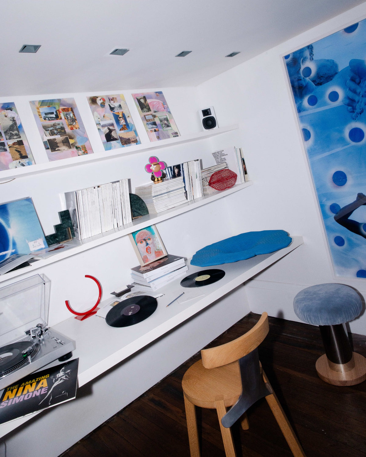 Books, bags and objects arranged across the apartment’s shelves and work surface.