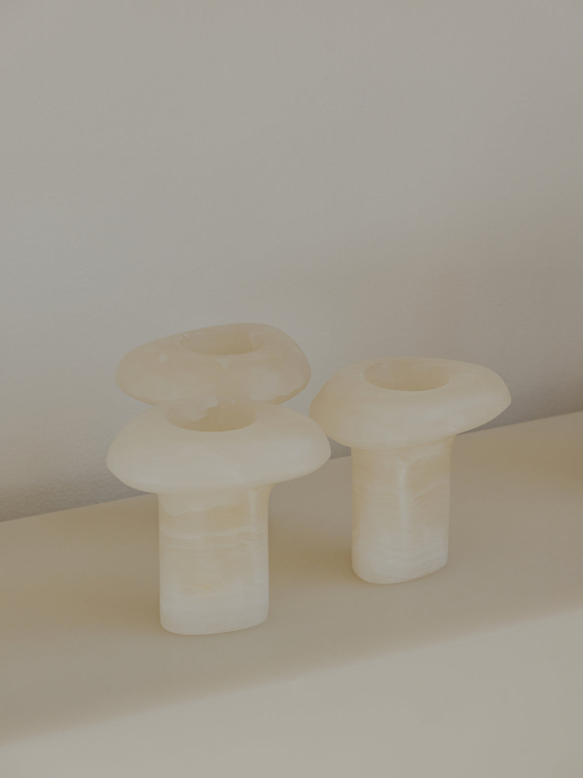 A detail of Tom Fereday’s glass objects, grouped on the display ledge.