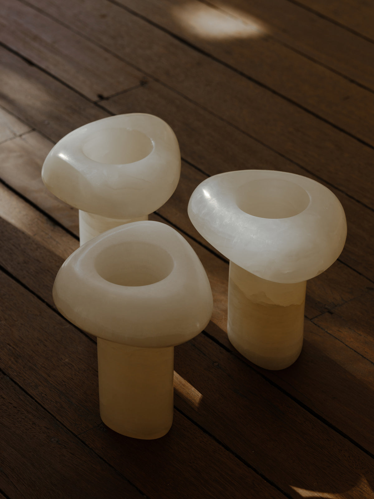 Tom Fereday’s glass forms on the apartment’s timber floor.
