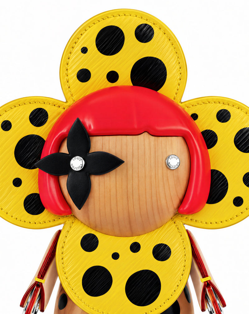Close-up of the yellow and black Louis Vuitton x Yayoi Kusama Vivienne figure