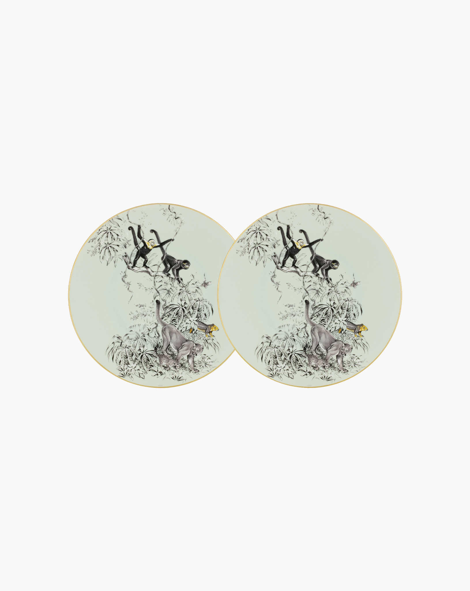 Pair of Hermès Carnets d'Équateur presentation plates on soft grey background