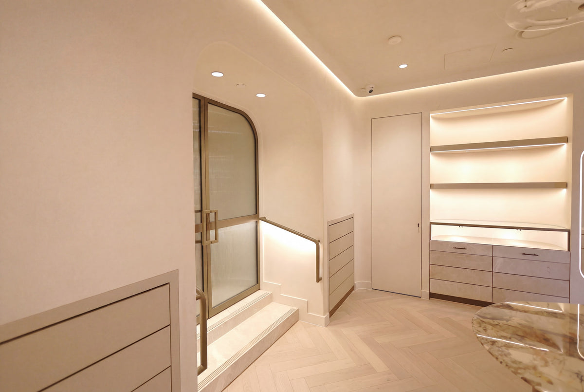 Stair, bronze-framed doors and joinery within the Three Over Six showroom