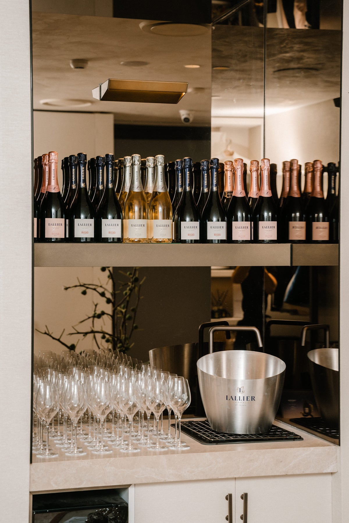 Champagne Lallier and glassware prepared for the gathering.