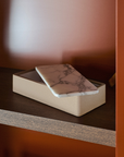 Greg Natale Palco Box Shagreen Arabescato with marble lid partly open on a timber shelf