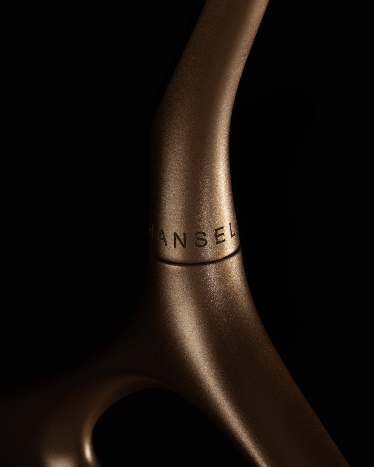 Lou Hansell gold hanger — engraved hook detail