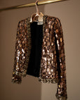 Sequinned jacket on a Lou Hansell leather-shouldered hanger