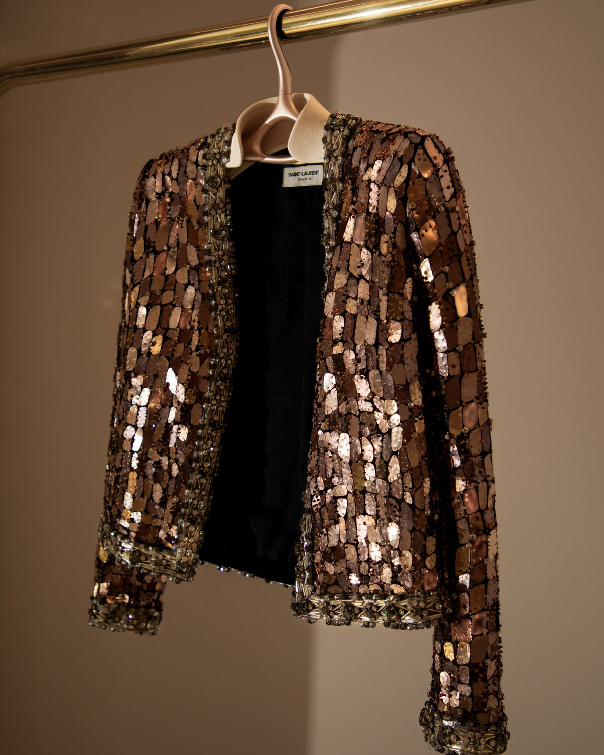 Sequinned jacket on a Lou Hansell leather-shouldered hanger