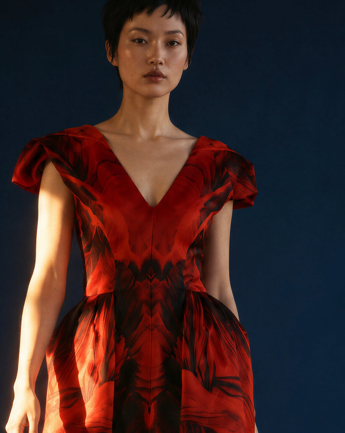 The enlarged print across the shaped bodice and skirt.