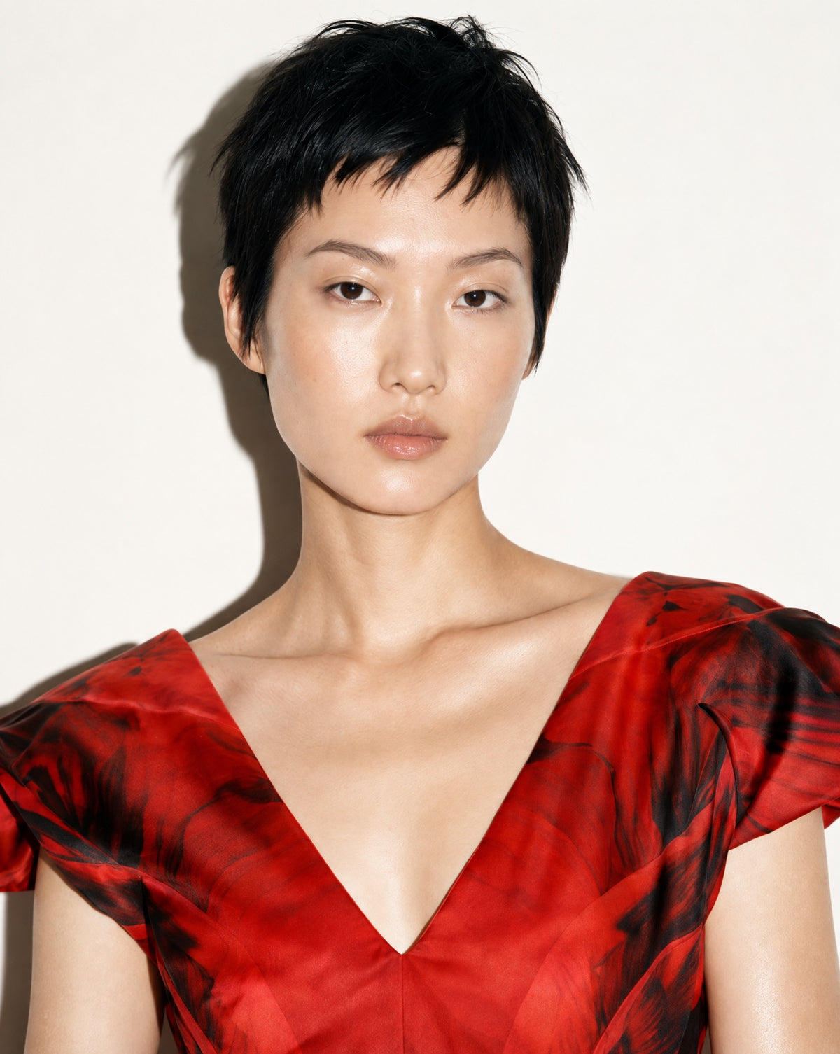 The V-neckline and sculpted sleeves, in close view.