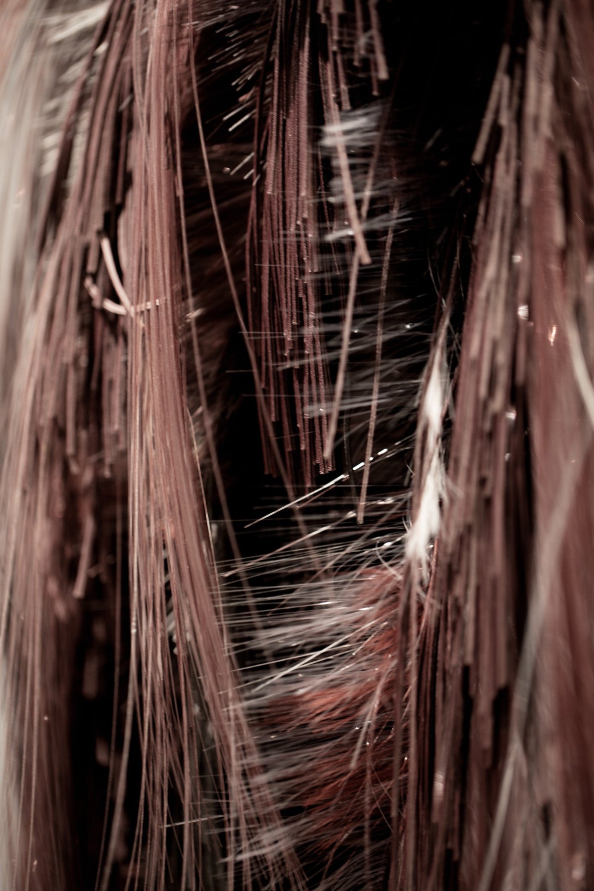 A close view of draped fabric and long fringe at Bottega Veneta