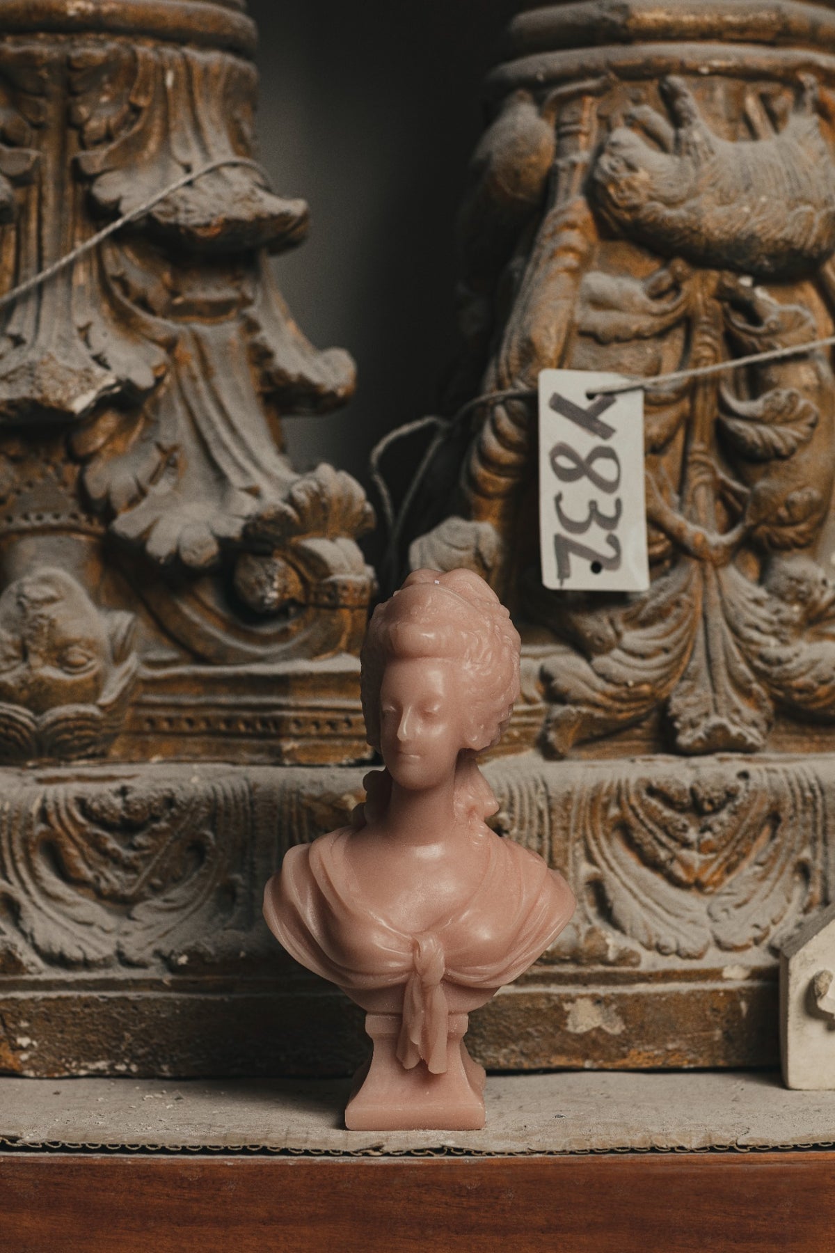 Trudon Marie Antoinette pink bust among historic sculptural moulds